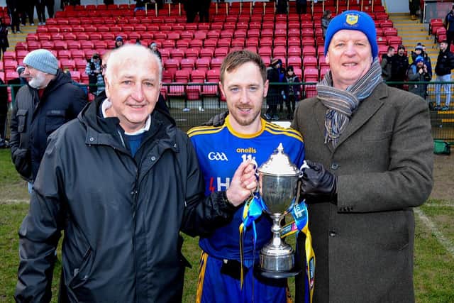 Brian Og McKeever senior (left) pictured with Steelstown captain Neil Forester and one of the club's founders Philip Devlin after the Brian Ogs won the Ulster title on Sunday. Photograph by George Sweeney.