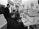 Bogside and Brandywell teenagers try out new computer stations at the Powerhouse under the watchful eye of centre co-ordinator Dougal McPartland.