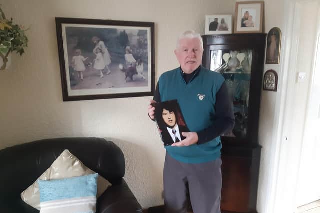 Leo Young pictured with a cherished photograph of his younger brother who was aged 17 when he was murdered by British paratroopers on Bloody Sunday.