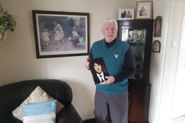 Leo Young pictured with a cherished photograph of his younger brother who was aged 17 when he was murdered by British paratroopers on Bloody Sunday.