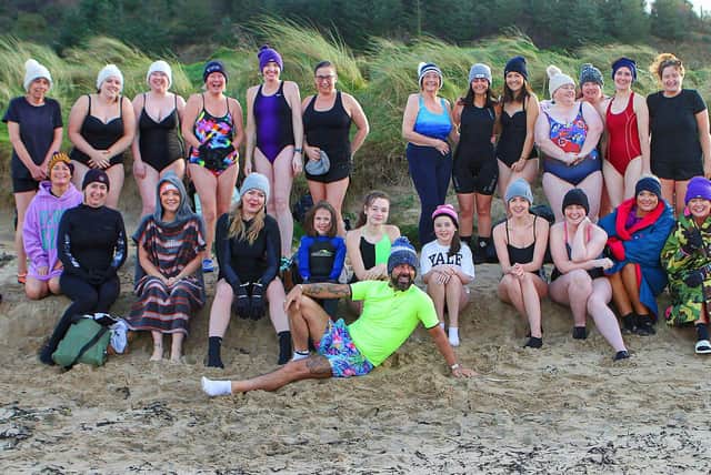 Derry's Mickey Doherty joins the ladies from the "Waves" cold water swim group organised by "Mammy Banter.'Serena Terry, for the New Year's swim at Lisfannon Beach. Photo: George Sweeney.  DER2152GS  022