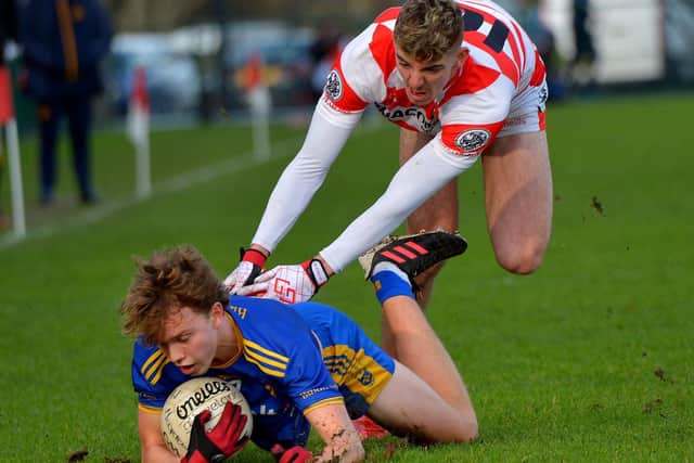 Moortown’s Sean Kelly fouls Steelstown’s Donnacha Gilmore during the Ulster GAA Football Intermediate Club Championship final at Owenbeg on Sunday afternoon last. DER2202GS- 040