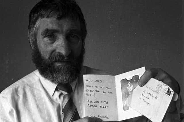 Eddie Fullerton pictured with a death threat which was posted to his home in Buncrana before his death.