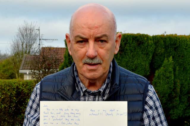 Carnhill shopkeeper Jim Barr with a copy of the letter which landed on New Year’s night.