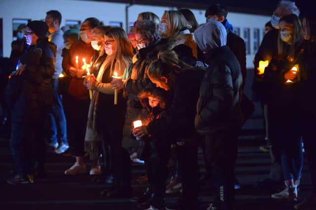 People attend a vigil and prayer service at St Oran’s National School in Cockhill on Saturday evening for John Kelly. Photo: George Sweeney. DER2202GS – 108