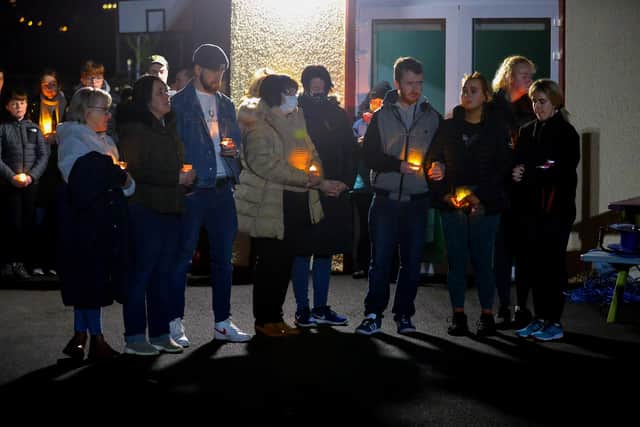 Grieving family members and relatives attend the vigil and prayer service at St Oran’s National School in Cockhill on Saturday evening for John Kelly. Photo: George Sweeney.  DER2202GS – 115