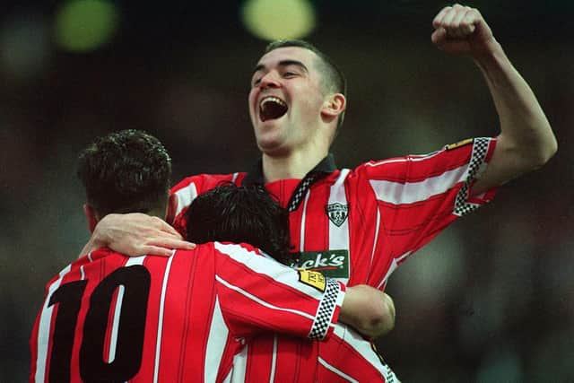 Sean Hargan celebrates in the iconic '97 title winning jersey - the last time Derry City brought the Premier Division trophy home to Brandywell.