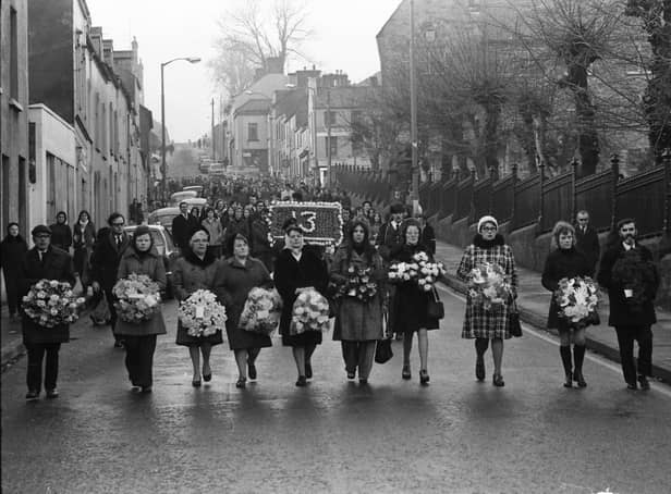 Families lead the 1974 commemoration march at Creggan Street.