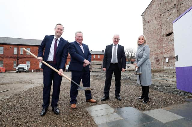 First Minister Paul Givan gets work on the hotel underway symbolically.
