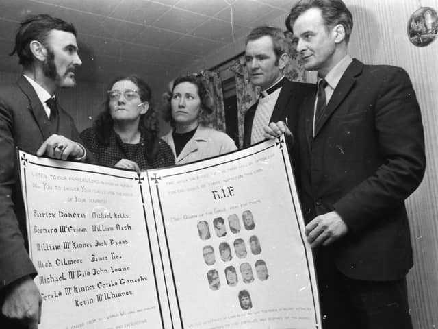 A Mass card made by the Derry internees at Long Kesh is presented on their behalf by Mr. Frank Gogarty (right), former chairman of the NI Civil Rights Association, to Mr. and Mrs. J. Wray, Drumcliffe Avenue, parents of James Wray, one of the Bloody Sunday victims in 1972.