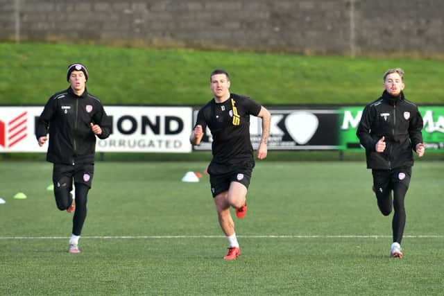 Eoin Toal, Patrick McEleney and Jamie McGonigle are put through their paces during preseason training. Photograph by Kevin Morrison.