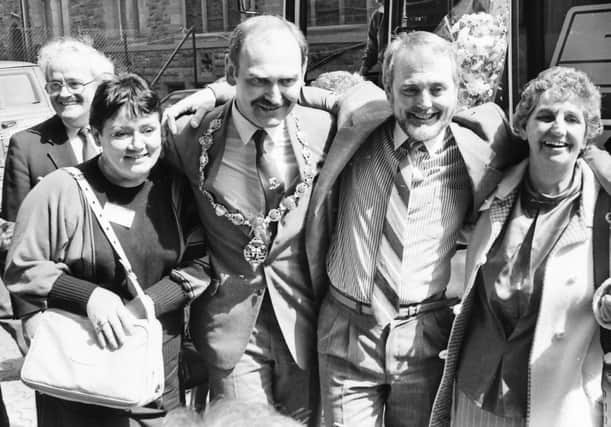 1987... David Connolly (second from right) pictured at Derry’s Guildhall Square after the ‘Colmcille Express’ arrived in the city.