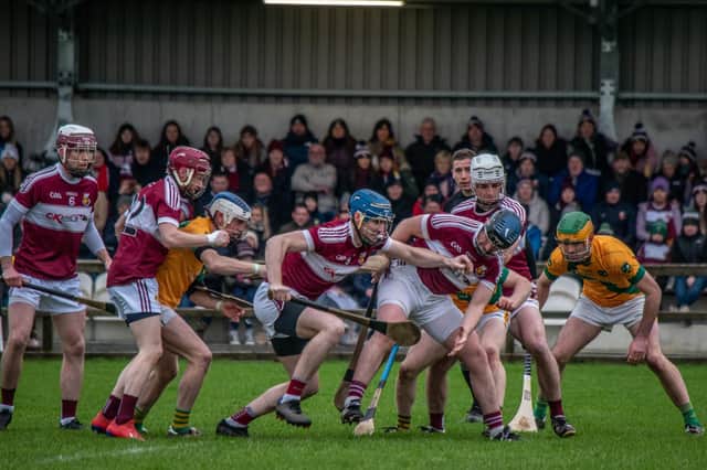 Banagher's Brian Og McGilligan battles his way through a posse of players during Sunday's AlB All Ireland Intermediate Club Hurling Championship semi-final against Kilmoyley at the Connacht Centre of Excellence. (Photograph by Ciara Buckley)