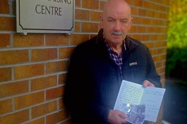 Jim Barr with the mystery letter and cash he has donated to the Foyle Hospice.