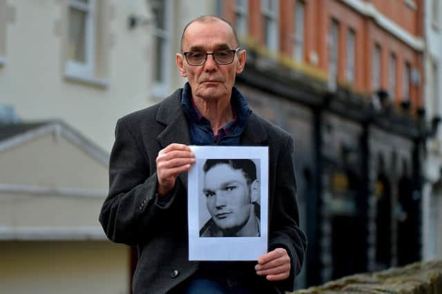 Liam Wray with a picture of his brother Jim. Picture: George Sweeney.