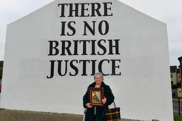 Kate Nash at Free Derry Wall, repainted for the 50th anniversary of Bloody Sunday, with a photograph of her 19 year-old brother William who was killed on Bloody Sunday. Photo: George Sweeney.  DER2203GS – 019