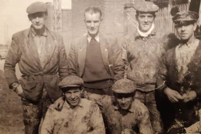 Alex Nash, back row far left, during one of his regular work trips to England.