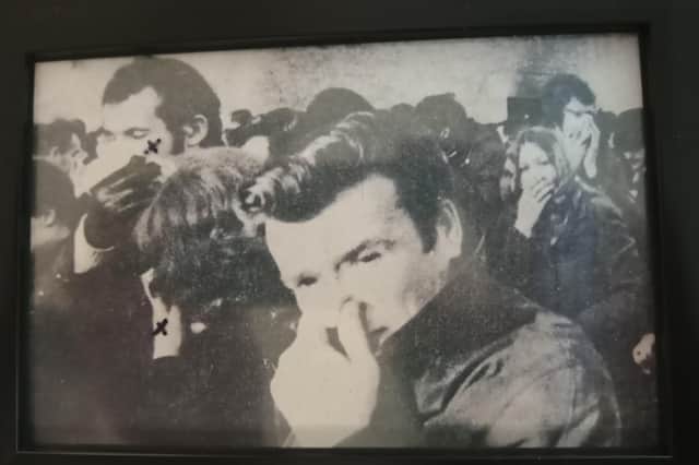 Sean McGlinchey (at back, wearing a glove) and his then girlfriend and later wife, Marietta, battling the effects of CS gas. The picture was printed in the Derry Journal in the days after Bloody Sunday.