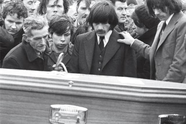 Former European lightweight champion Charlie Nash pictured paying his respects beside the coffin of his brother William who was murdered on Bloody Sunday. Photograph by Gilles Peress/Magnum Photos.