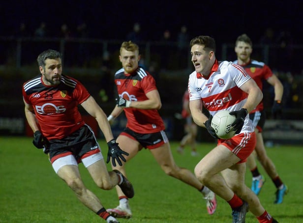 Down’s Kevin McKernan closes in on Derry’s Padraig McGrogan in Owenbeg on Saturday evening last. DER2204GS – 055 (Photo: George Sweeney)