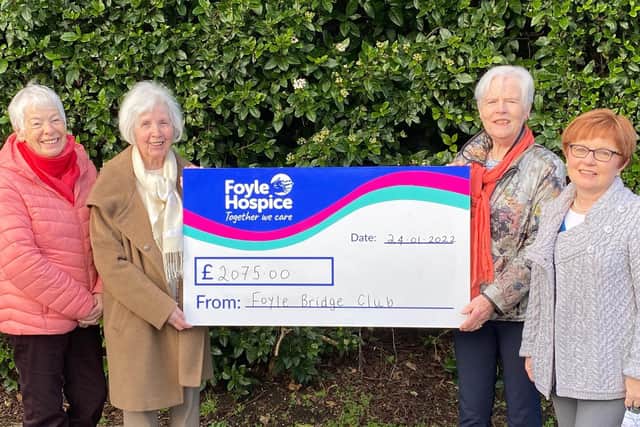 Foyle Bridge club members donating the last of their funds to the Foyle Hospice