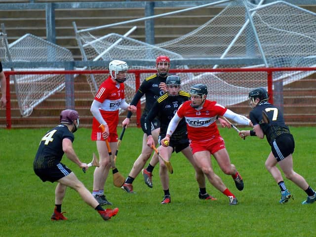 Sligo players close in on Derry and Na Magha's Deaghlan Foley during this afternoon's Alliance Hurling League Division 2B game in Celtic Park. (Photo: George Sweney)