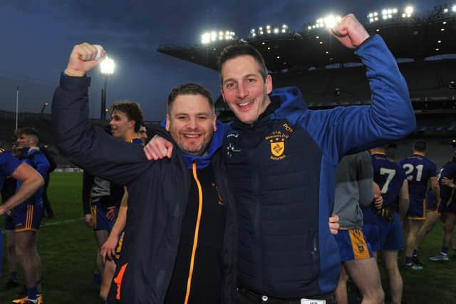 Steelstown Brian Ogs manager Hugh McGrath and Chairman Paul O'Hea celebrate on the Croke Park pitch after becoming the first Derry club to ever lift the Intermediate title. (Photo: George Sweeney)