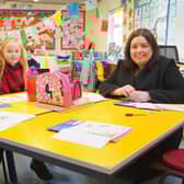 Communities Minister Deirdre Hargey is pictured with pupils from Scoil an Droichid on a visit to open the 2022 Líofa Gaeltacht Bursary Scheme