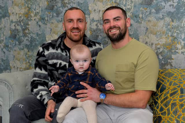 Jon and Patrick Coyle pictured with 6 months old Wren at their home in Muff.  Photo: George Sweeney.  DER2206GS – 099