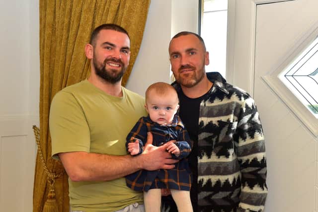 Patrick and Jon Coyle pictured with 6 months old Wren at their home in Muff. Photo: George Sweeney. DER2206GS – 100