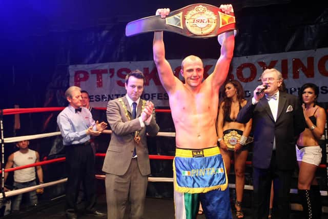 Former Mayor Of Derry Counsellor Colm Eastwood joins in the celebrations, as Daniel 'Pinta' Quigley retains the ISKA World Heavy Weight Title, after beating Pacome Issa of France, in St Columb's Hall in 2011.
