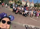 Aine McFadden, Team Leader at Tuned In, takes a 'selfie' with a group of students and staff who went on the first trip to Disney.