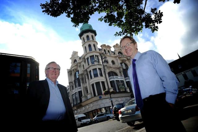 Hasson brothers Luke (left) and Declan outside their iconic store in the Diamond