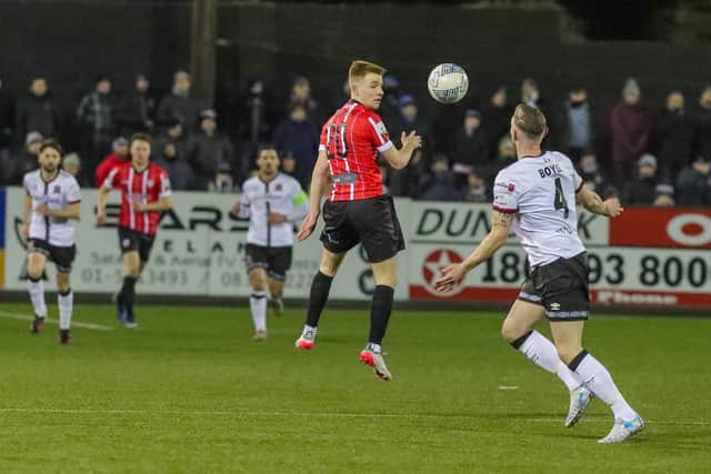 Debutante Brandon Kavanagh attempts to find a teammate during the first half. Photograph by Kevin Moore.