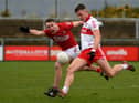 Derry forward Shane McGuigan scores one of his eight points against Cork in Owenbeg this afternoon. (Photo: George Sweeney)