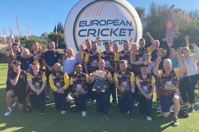 Brigade players, back-room staff and supporters celebrate their European Cricket League group win, in Malaga.