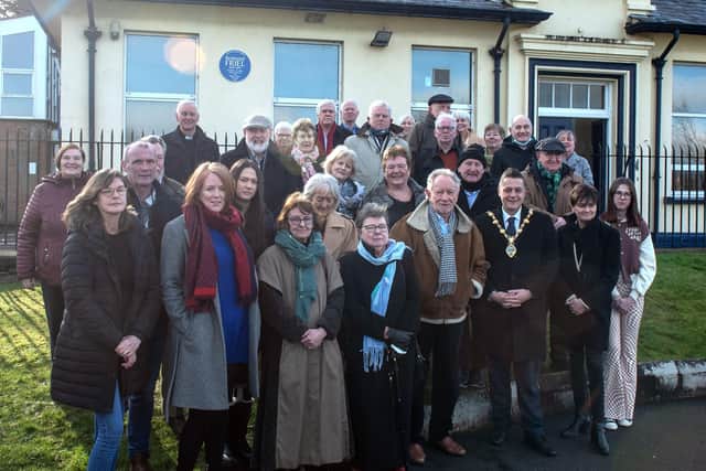 Friends, family and former pupils of Redmond Friel, including Phil Coulter, with the Mayor Graham Warke at the unveiling of the plaque.