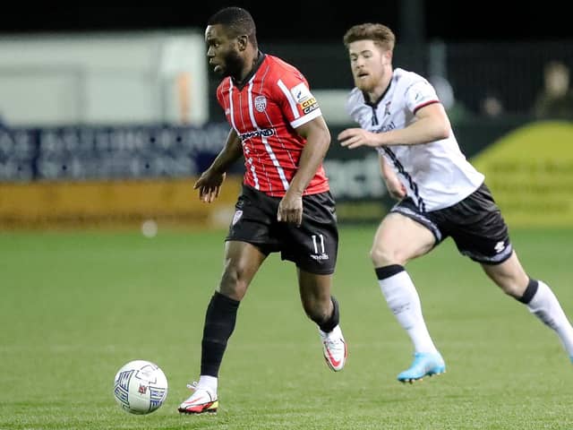 Derry City's James Akintunde skips away from Dundalk defender Sam Bone. Picture by Kevin Moore/mci