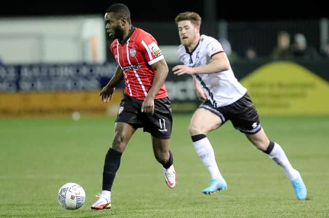 Derry City's James Akintunde skips away from Dundalk defender Sam Bone. Picture by Kevin Moore/mci