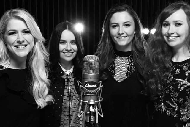 Mairead Carlin, second from the left, recording at Capitol Records with her Celtic Women co-stars. The recording was for an appearance at the Grammy Awards and the microphone seen in this picture was once used by Frank Sinatra.