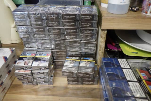 Some 6,500 cigarettes and 900g of hand rolling tobacco were seized after a search of eight shops in Derry.