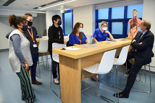 Professor Neil Mortenson (on right) chats to trainee doctors during his visit to the School of Medicine in Derry this week.