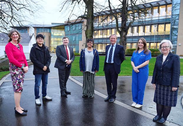 Professor Neil Mortenson (third from right) with students and staff at the UU School of Medicine in Derry.