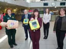 Minster Mallon is pictured with left to right: Jacqueline O'Neill, Community Resuscitation Officer, NIAS; John Glass, Translink Director of Infrastructure and Projects;  Denise McAnena, Policy Manager, British Heart Foundation NI and Lynda Donaldson.