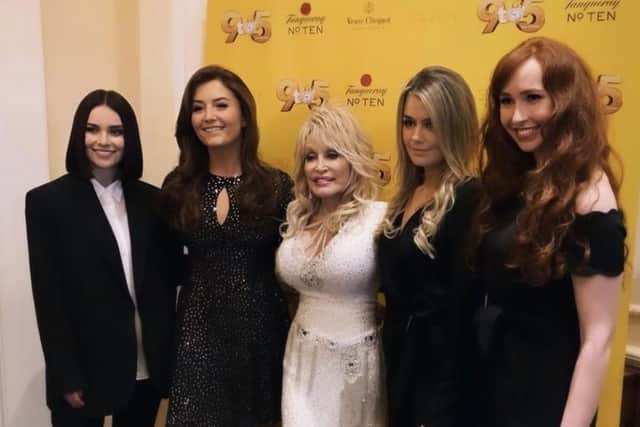 Mairead and the cast of Celtic Women meeting legendary country music star Dolly Parton.