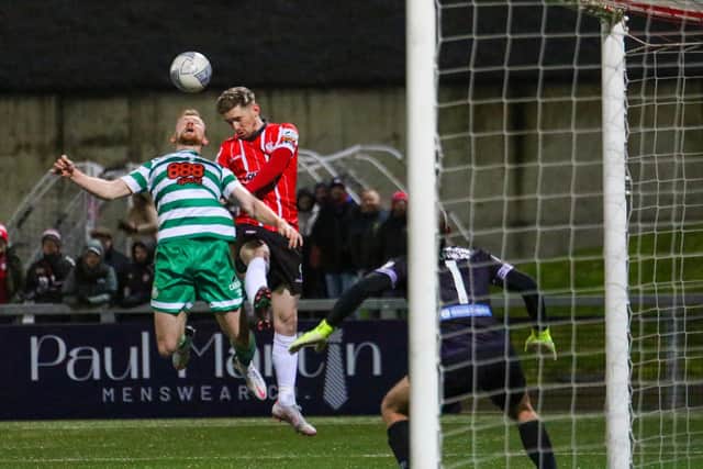 Jamie McGonigle rises highest to meet this ball against Rovers.
