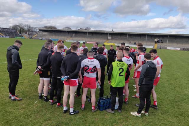 Derry manager Rory Gallagher talks tom his players after Sunday's nine point defeat of Clare in Cusack Park, Ennis.