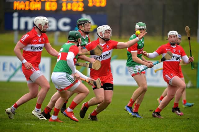 Derry ‘s Eamon McGill gain possession under pressure from Mayo’s Brian Hunt at Owenbeg on Sunday afternoon last. Photo: George Sweeney. DER2209GS – 002