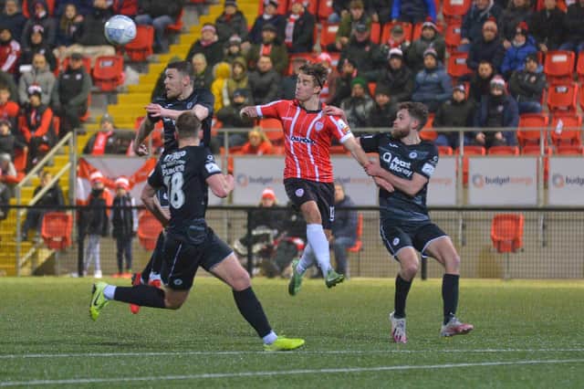 Derry City debutante Mattie Smith put under pressure by Sligo Rovers players. Photo: George Sweeney
