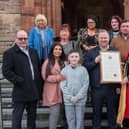 Adrian, Kevin and Stephen McManus who received the Freedom of the City from Derry City and Strabane District Council Mayor, Alderman Graham Warke, on behalf of their father the late Pat McManus in recognition of his commitment and service as a NHS nurse. Mr. McManus died on the 9th of April 2020 aged 60 at the Royal Stoke University Hospital after contracting Covid-19. Included are family members, Martin McManus, brother, Aimee Ward, niece, Noah Mullen nephew, Frances Molloy, cousin, Tanya Watkins, sister-in-law, Aileen Mullan, niece, Harley Mullen niece and family friend Martin Duffy. Picture Martin McKeown. 28.02.22